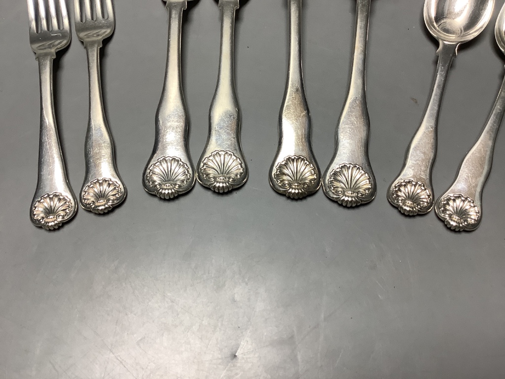 Seven items of George IV silver shell pattern flatware, William M. Traies, London, 1829, one other similar dessert fork and three silver handled knives, weighable silver 19.5 oz.